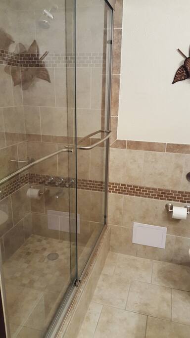 Beautiful tile shower newly renovated, also handicap accessible.