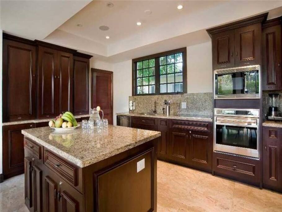 Granite and brazilian cherry wood island.