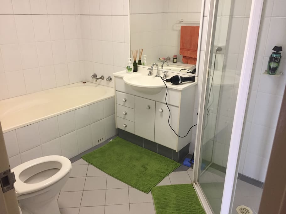 Private bathroom with separate shower and bath tub.