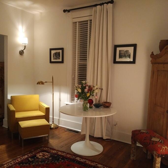 Entrance to suite with antique pine armoire housing TV and Blueray player