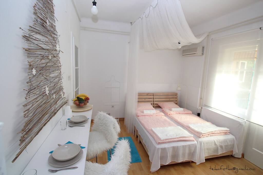 A baldachin with lights above the bed