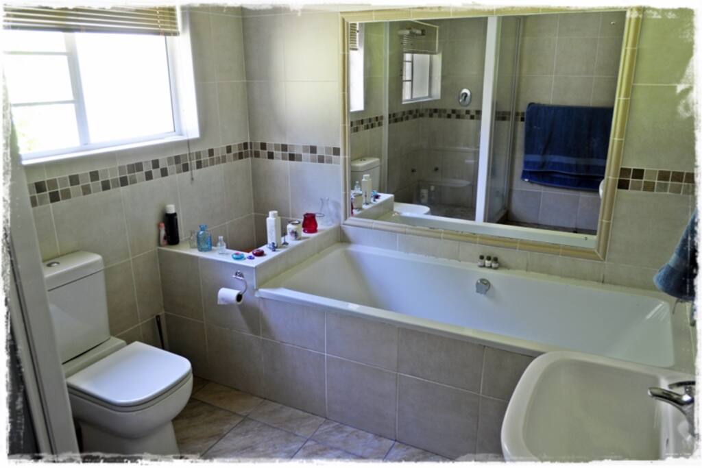 This is the bathroom showing the toilet and the bath