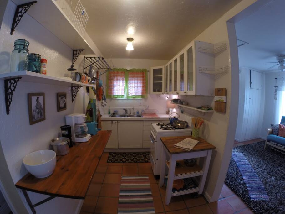 Retro kitchen with full sized fridge, stove, microwave