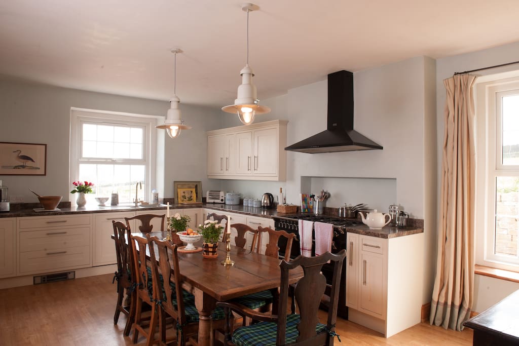The Farmhouse kitchen with Range cooker and refectory table