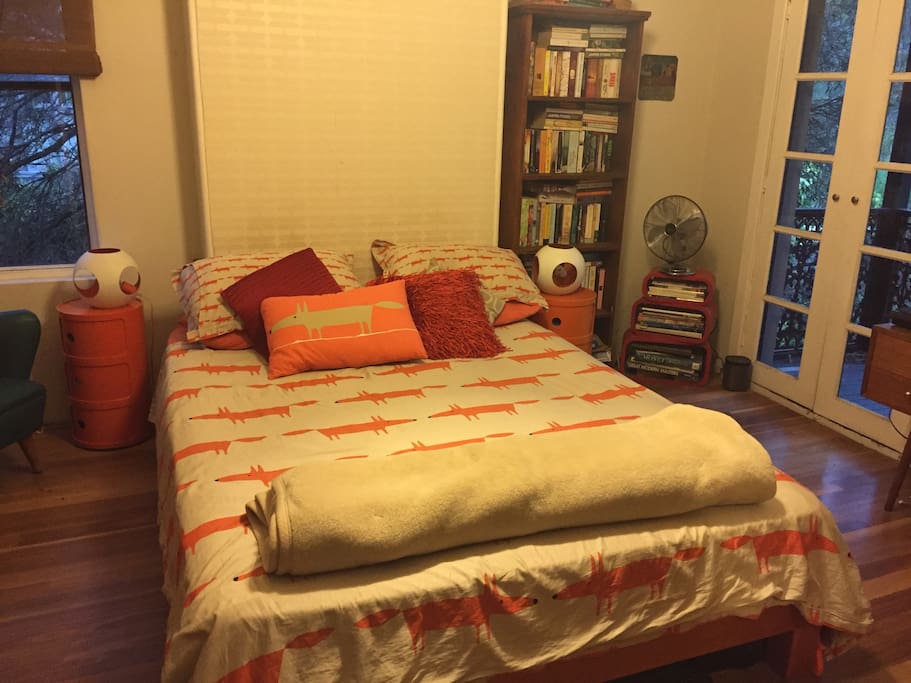 Master bedroom with balcony overlooking the park