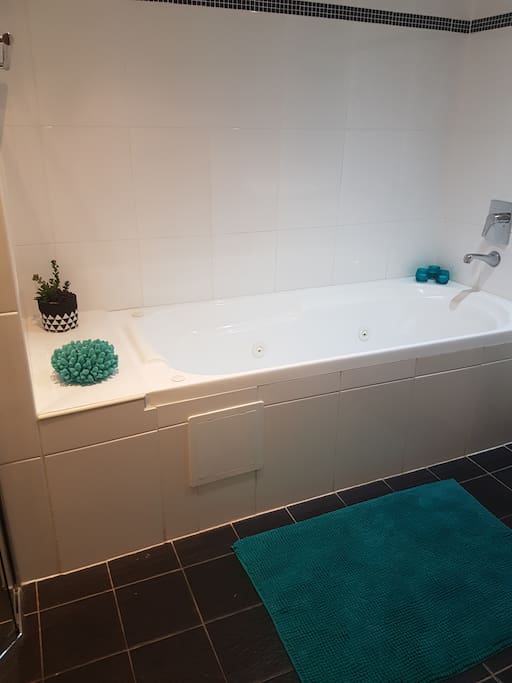 Full private bathroom with shower and spa bath
