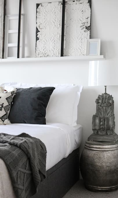 This bedroom has a bathroom just next door.