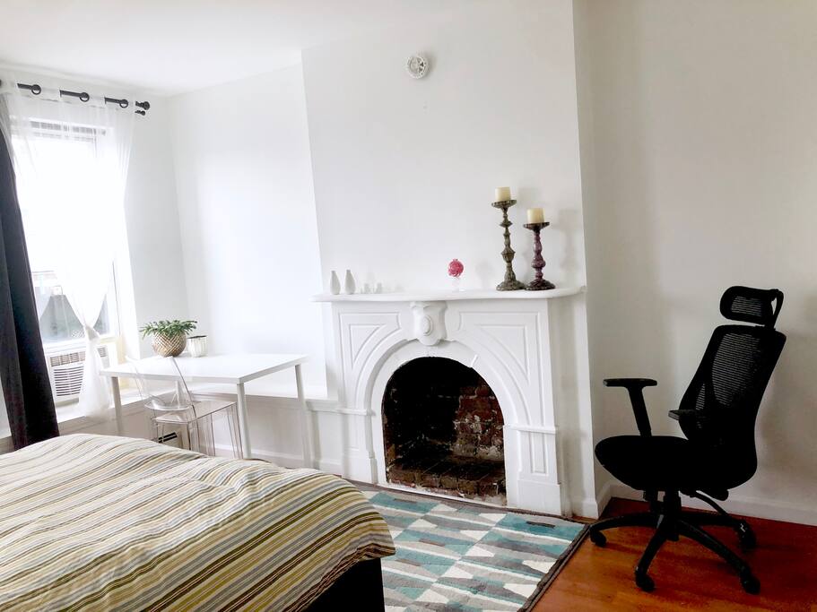 Bright windows, lots of sunshine, work desk, ergonomic chair and fireplace ;)