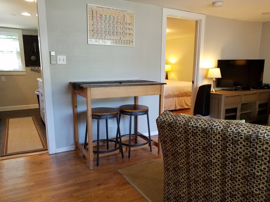 Stools fit easily under the old chemistry lab table/dining table.
