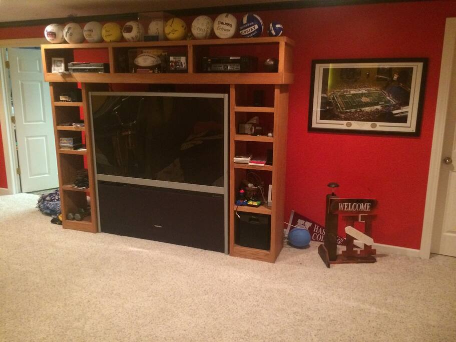 big screen in family room next to toy room with big screen
