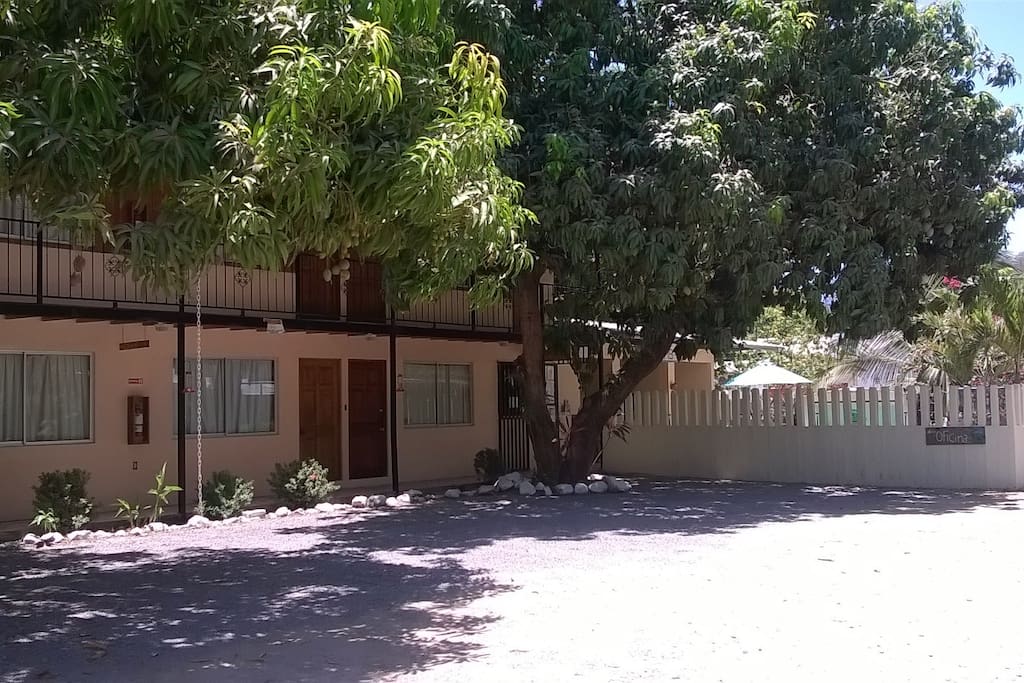 Side view of Cabins 1-8 with surrounding Pool Fence