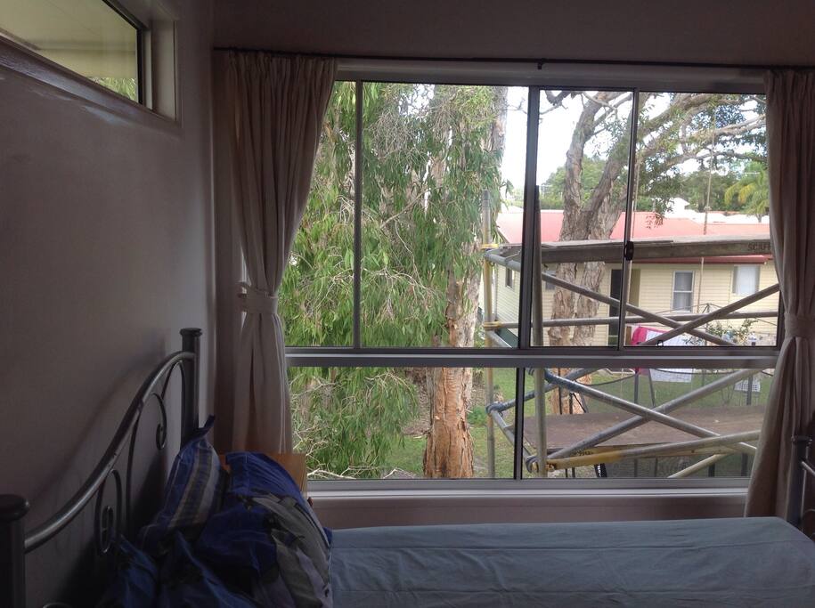 Hopefully the scaffold will be gone before you arrive. The room overlooks our yard and is quiet and private with its own entrance