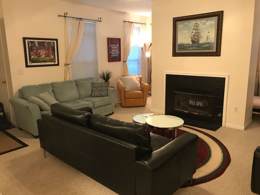 Large family room with multiple chairs & multiple sofas!