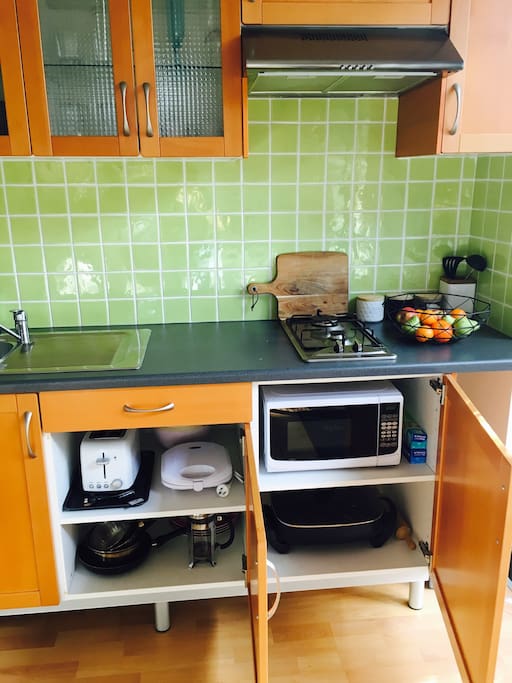 All kitchen appliances provided; microwave, toaster, electric fry pan, pots, pans, plates, utensils.