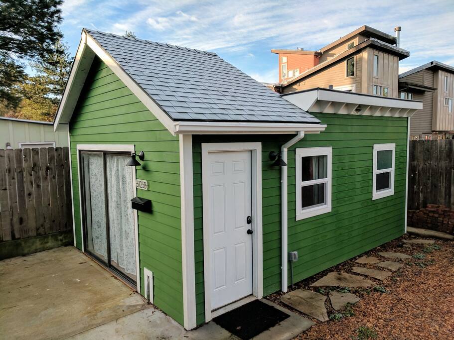 The stand-alone garden studio is situated in our backyard.