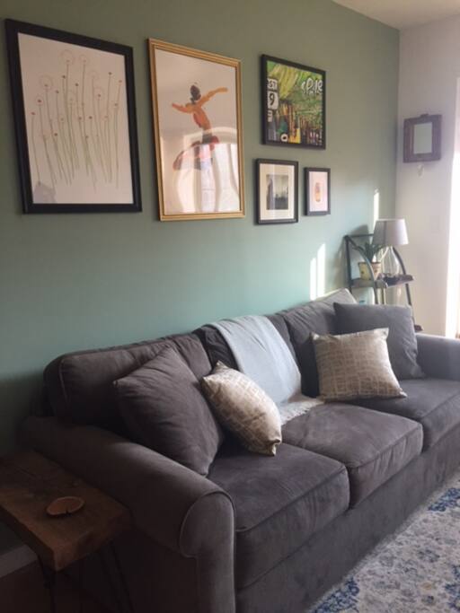 The kitchen opens up to the living room with new comfy couch perfect for sleeping one!