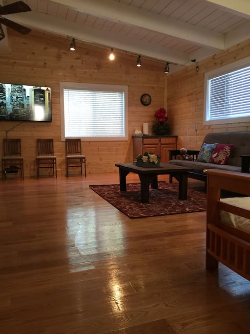 2nd floor living room with foosball game table and another 60" TV set, foosball game table, 2 fultons, free wifi, free Netflix movies, chromecast, etc.