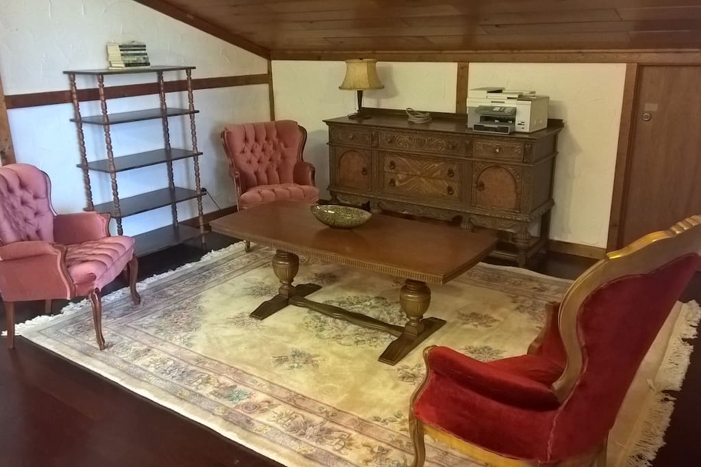 Antique furniture, German carved coffee table and hand knotted and cut rug.