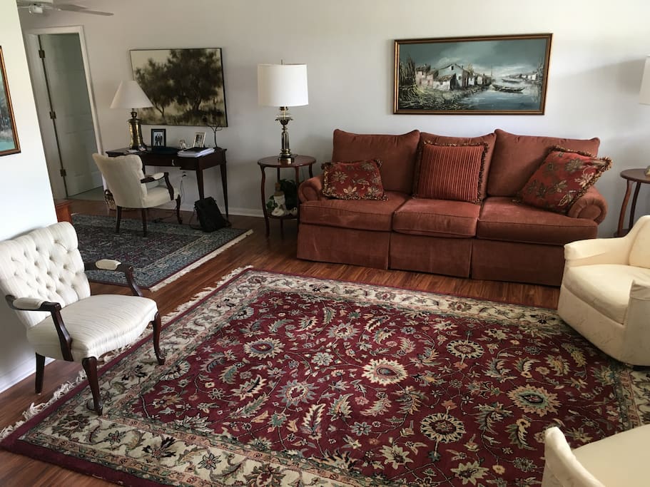 Comfortable living room with desk for business/personal affairs.