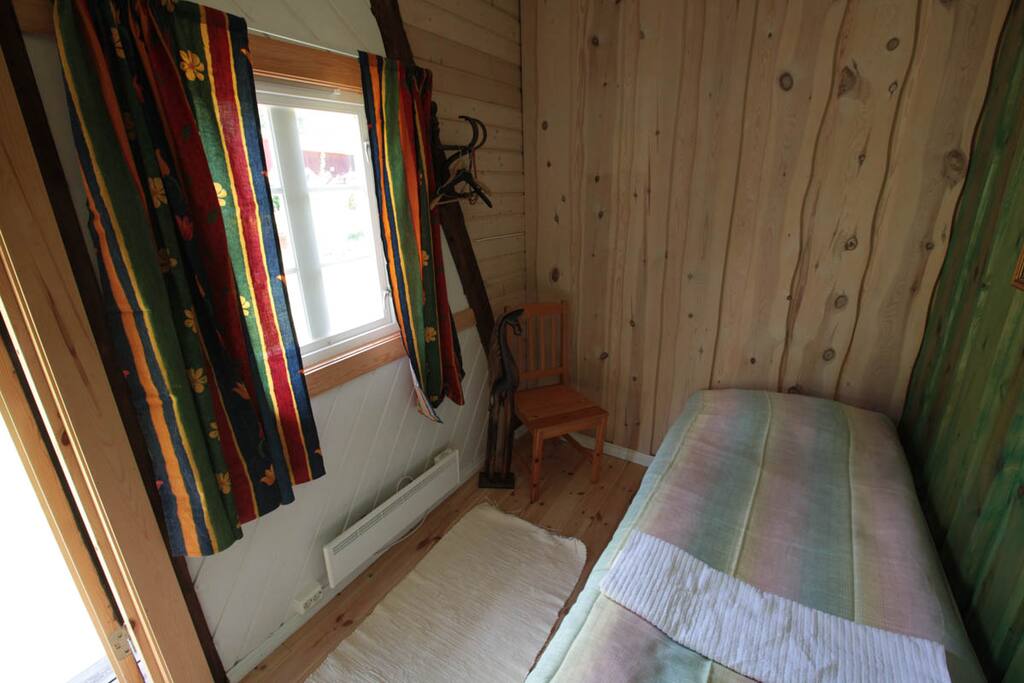 A small room with single bed