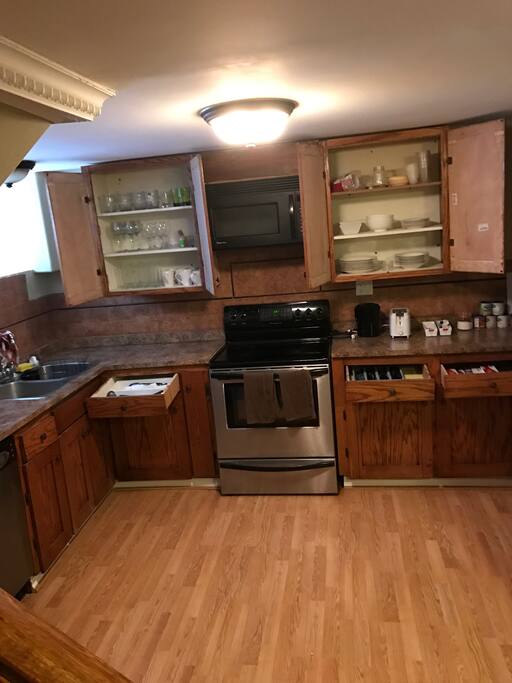 Fully stocked kitchen including; coffee machine, cutlery, dishes, glasses, cooking utensils, assortment of tea, salt, pepper, etc.