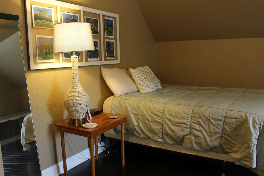 The full-size bed and nightstand.