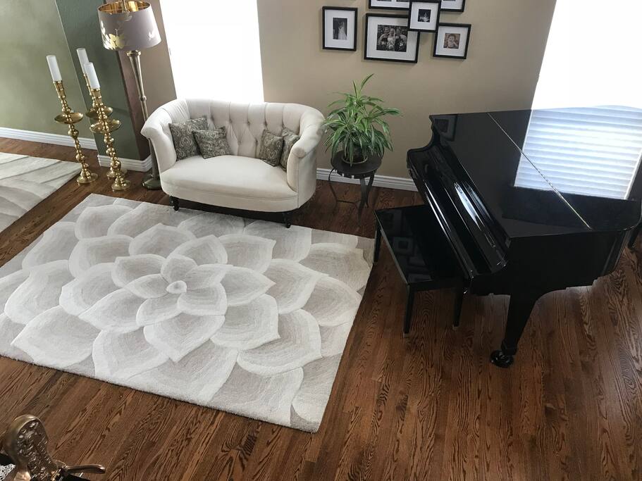 Have someone play a tune on the Grand Piano.
