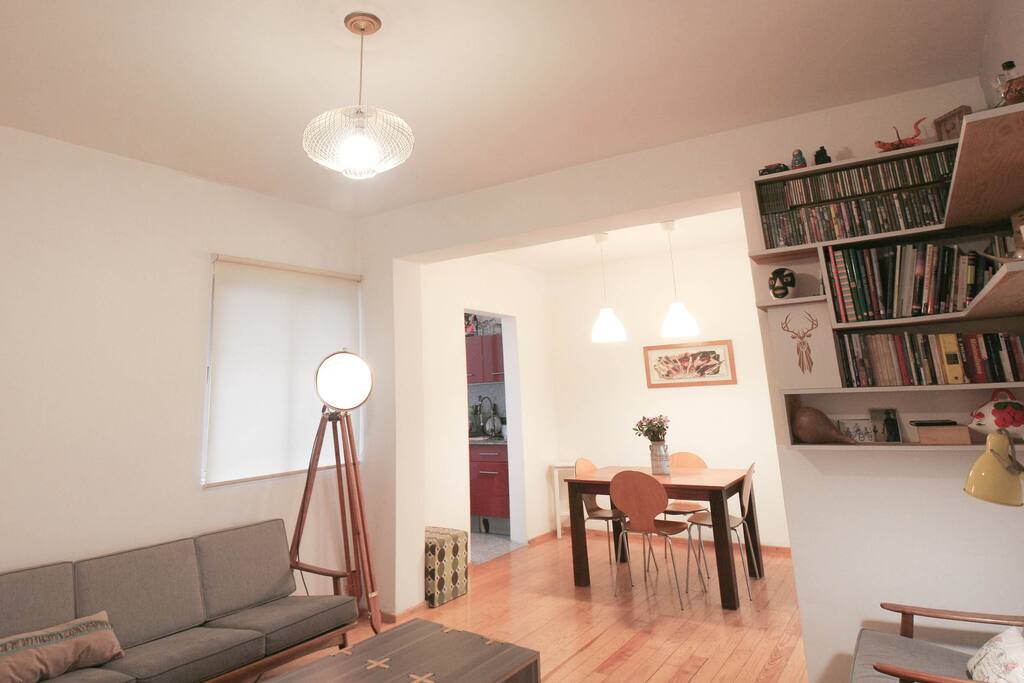 Well illuminated dining room gives access to the intimate yard and the kitchen.