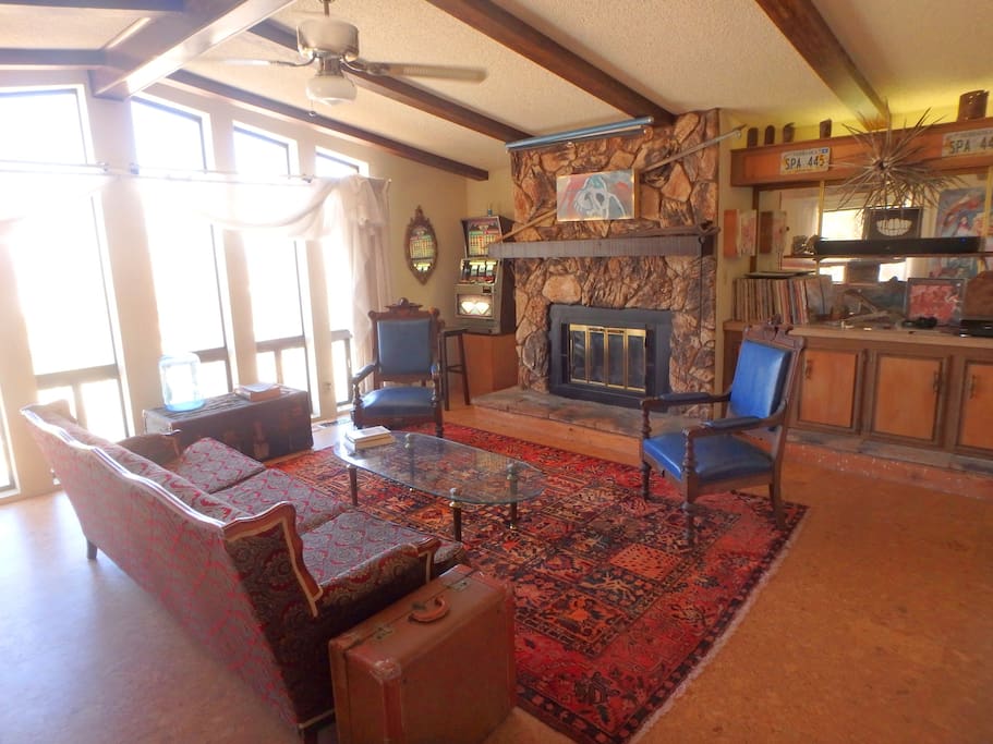 Living Room has six ceiling-to-floor windows (church-like?) facing north into the valley