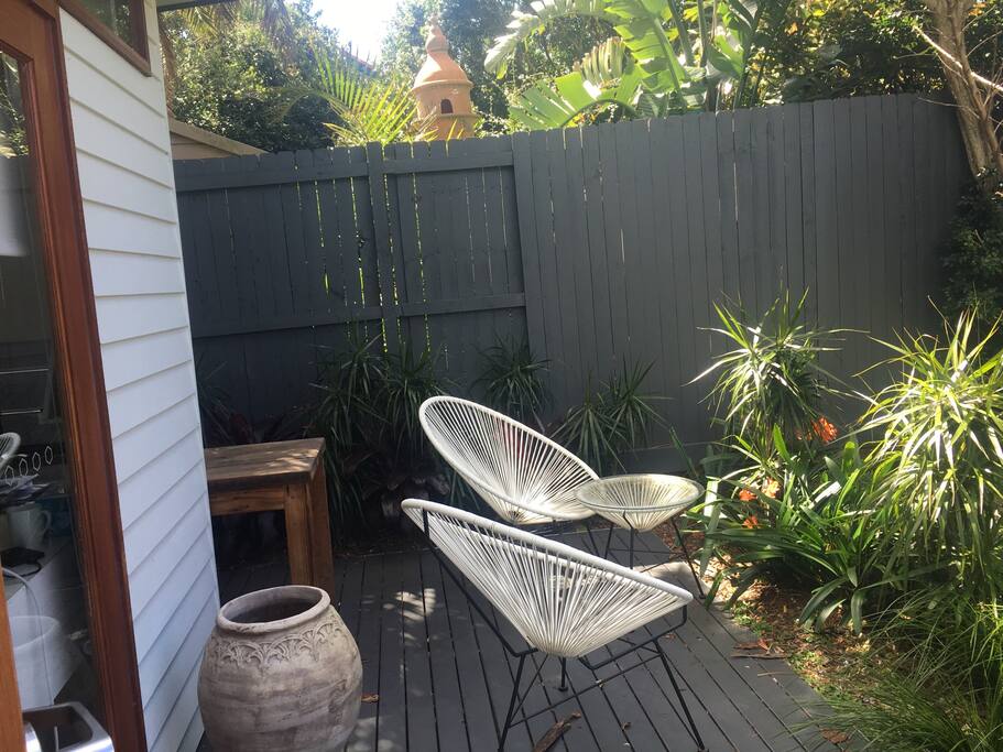 Outdoor dining area overlooking newly landscaped garden