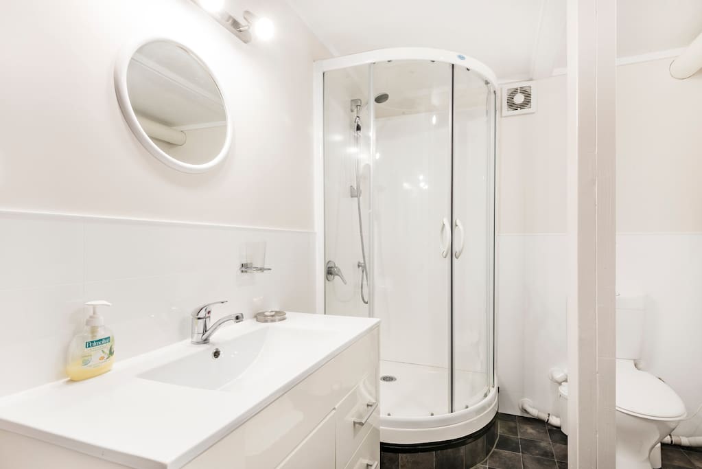 Full bathroom and laundry downstairs serves both downstairs bedrooms
