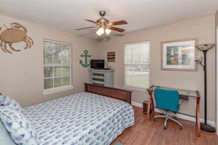 Bedroom 2 has Queen size bed, desk, chair and lamp, as well as dresser storage cubbies in closet. Small tv