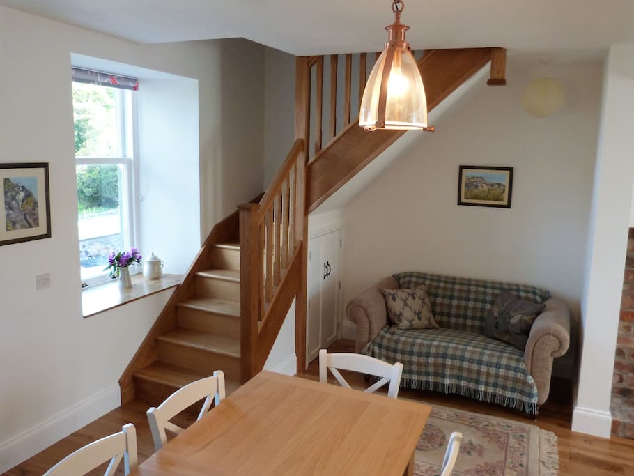 Dining area snug with stunning views of the bay. Oil central heating.