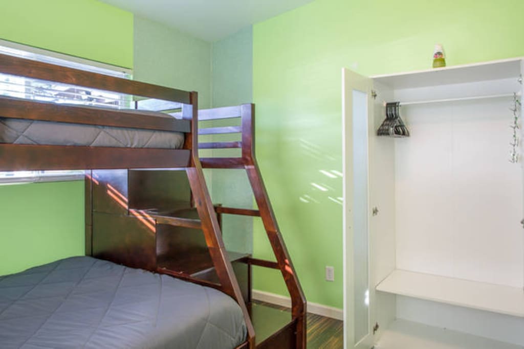 Bunk bed with closet in side the room