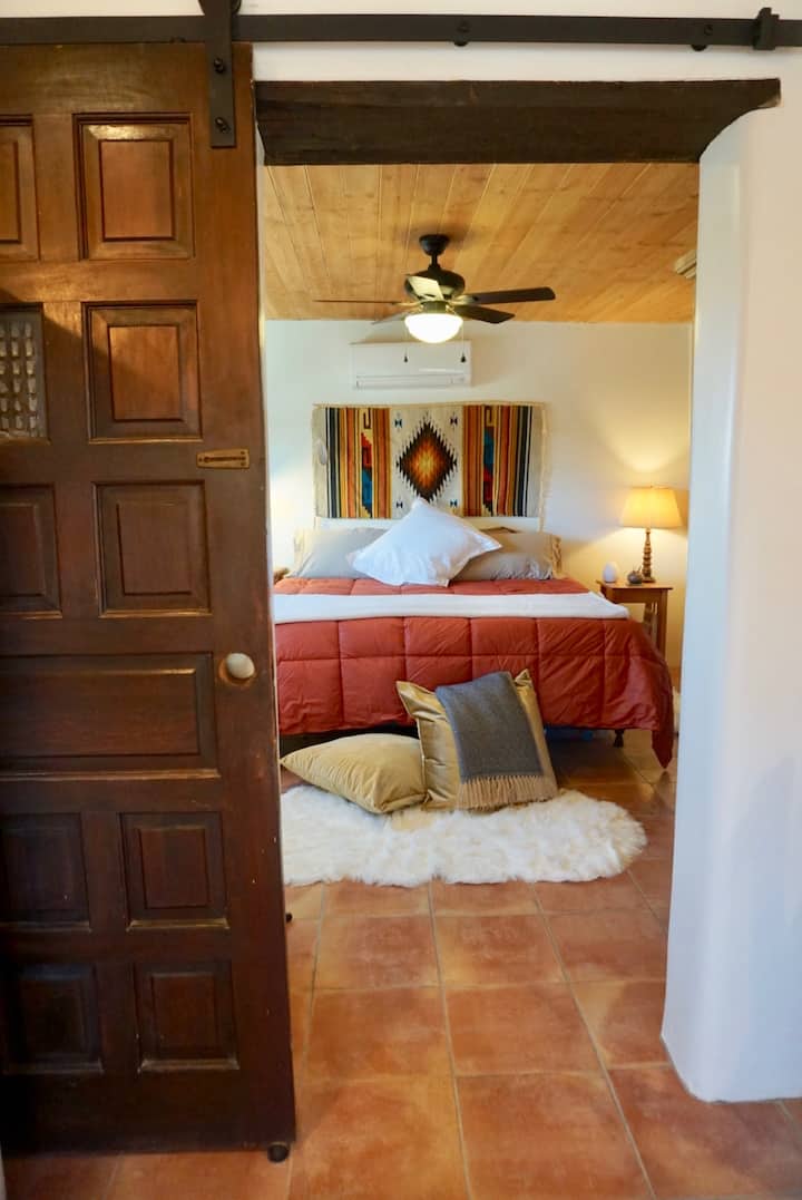Handcarved barn door into bedroom