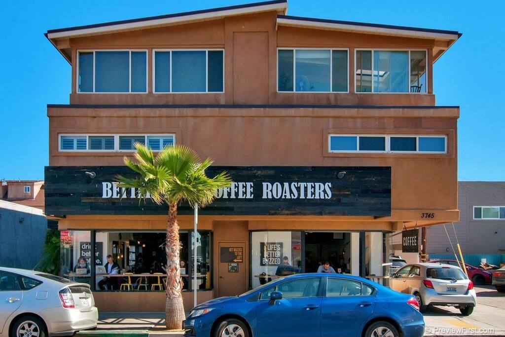 Upstairs on the right with a terrific coffee shop just below