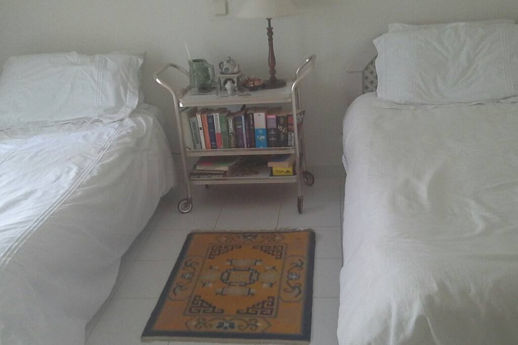 Twin beds that can be pushed together to make a double bed.