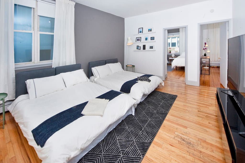 The living room couch consists of four individual fold out twin mattresses which can be configured as two fulls or four twins (or a really massive king!). Windows are treated with black-out pull down shades for those who are using the room for sleep.