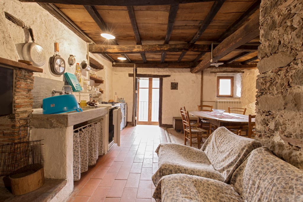 View of kitchen, dining room table, and door to the terrace