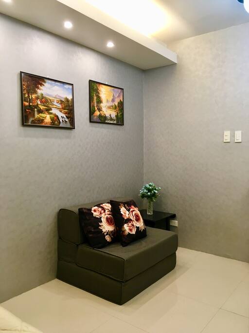 Lounge area to watch tv. The sofa is convertible so could be a single bed for an additional guest.