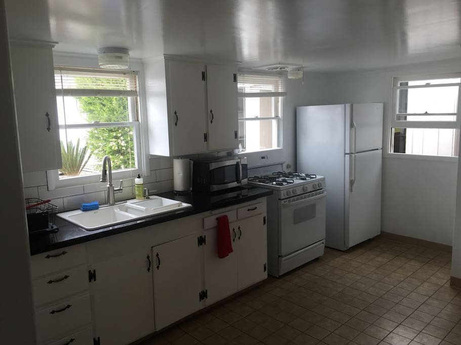 The kitchen is bright, lots of room to prepare meals. Has new microwave