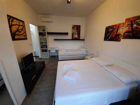 Room with bathroom in Neviano