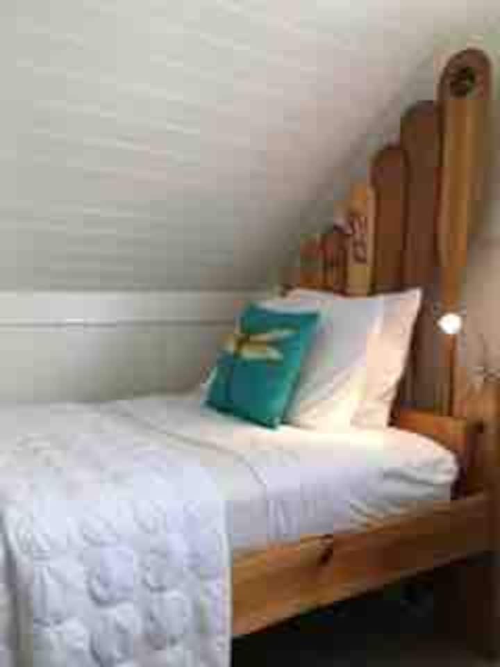 One of the beds in loft area