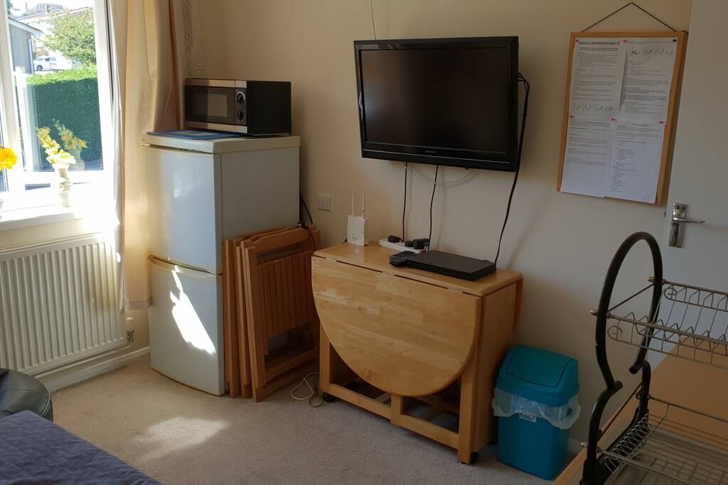 Fridge freezer, microwave and four seater extending dining table