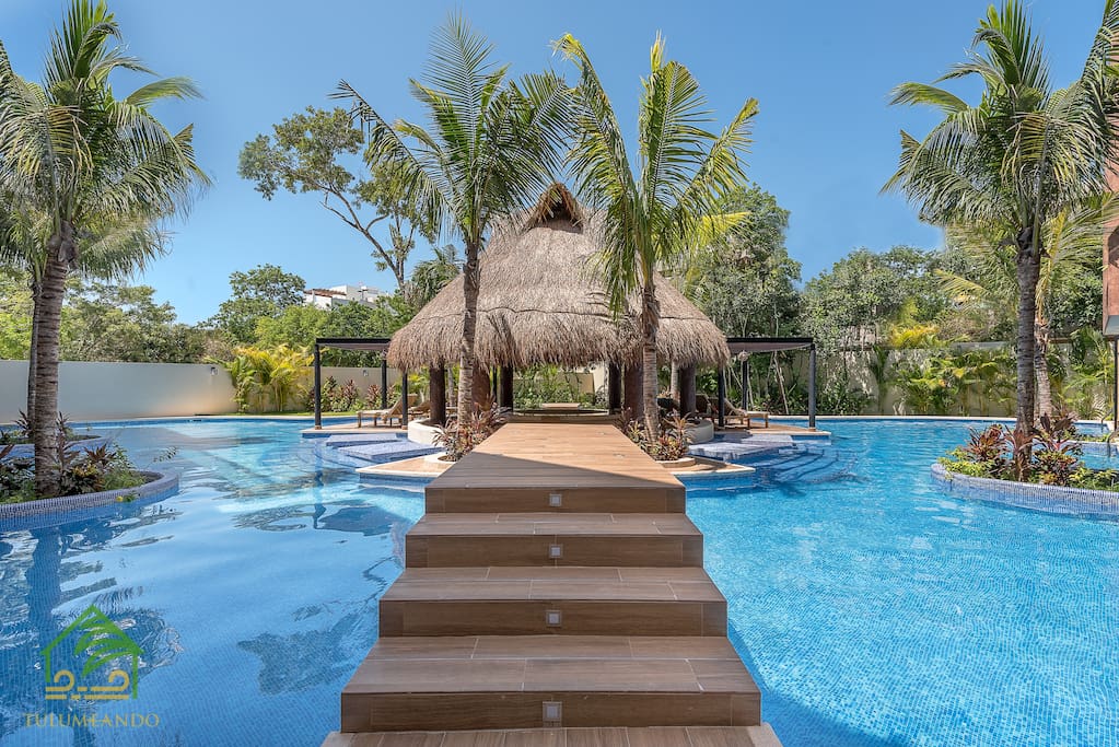 Huge swimming pool around the jungle