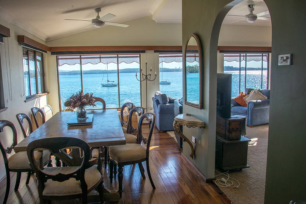 Large dinning table looks out onto the lake.
