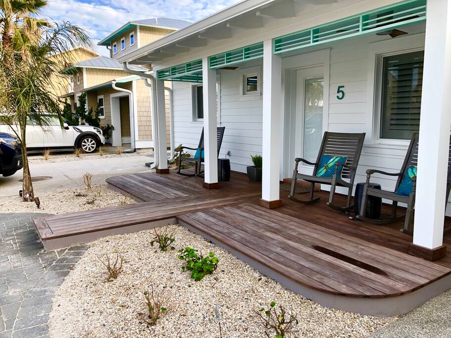 Exotic hardwood decking front and back of home.
