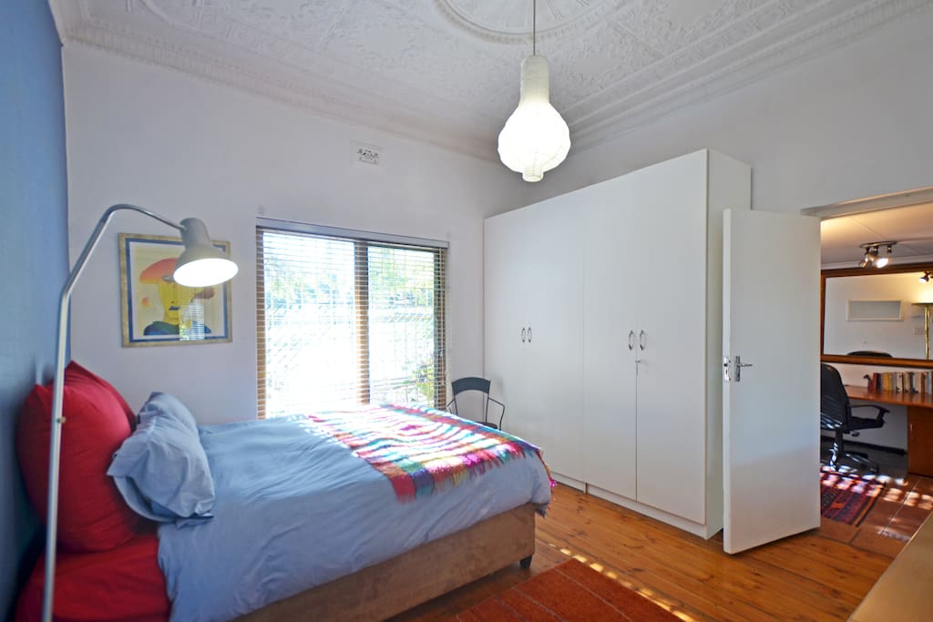 Bedroom leads on to second room with work desk, bathroom and kitchenette. The room has a door on either side -own front door and a door to the courtyard.