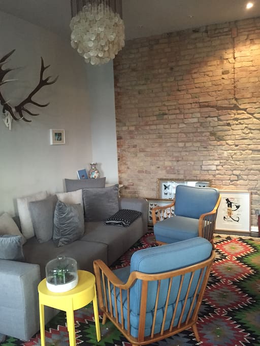 living room w/ brick wall