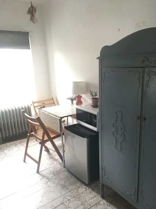Purple hutch for your belongings and the kitchenette area